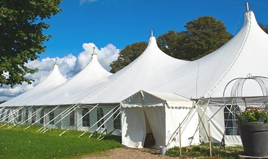 a group of luxury portable toilets with individual stalls and running water in Chatsworth